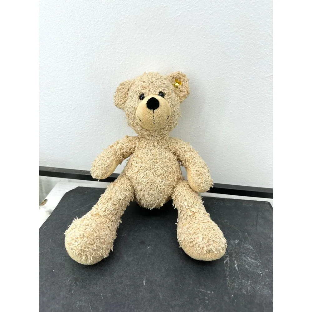 Small Steiff Fynn blonde stuffed teddy bear textured plush